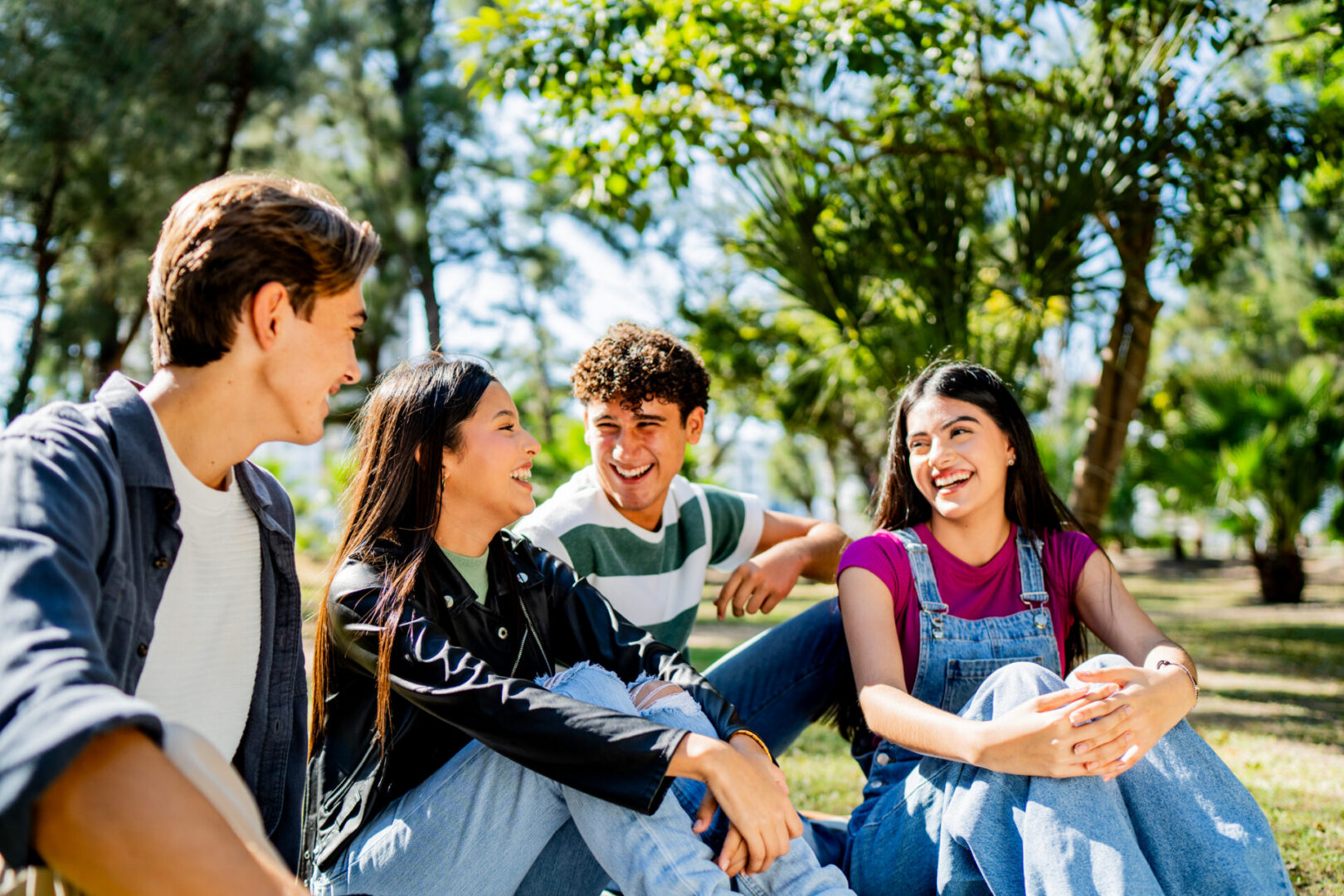 Teenager friends talking on public park